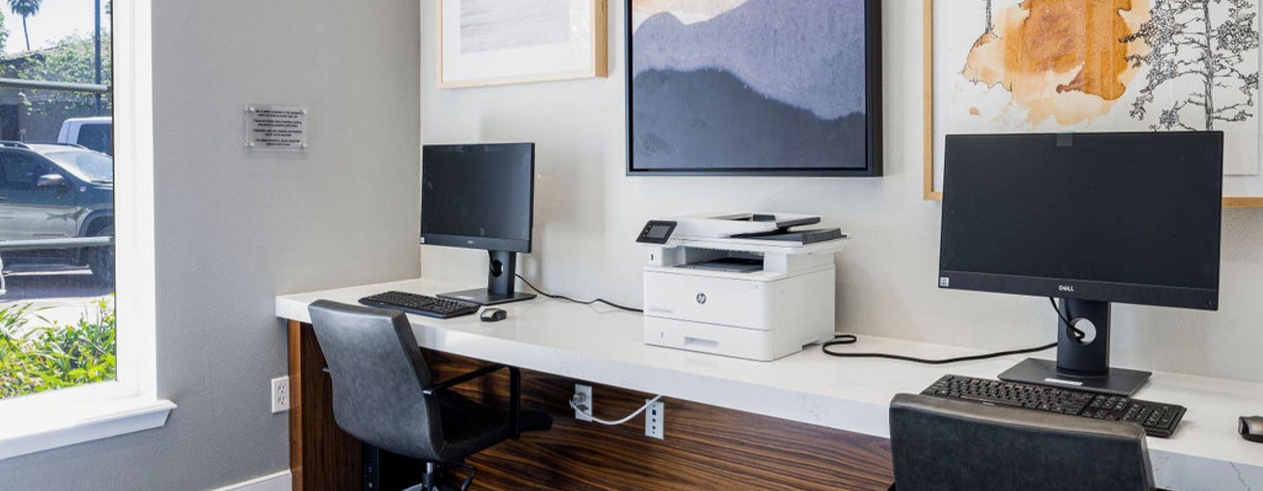a room with a desk and computer