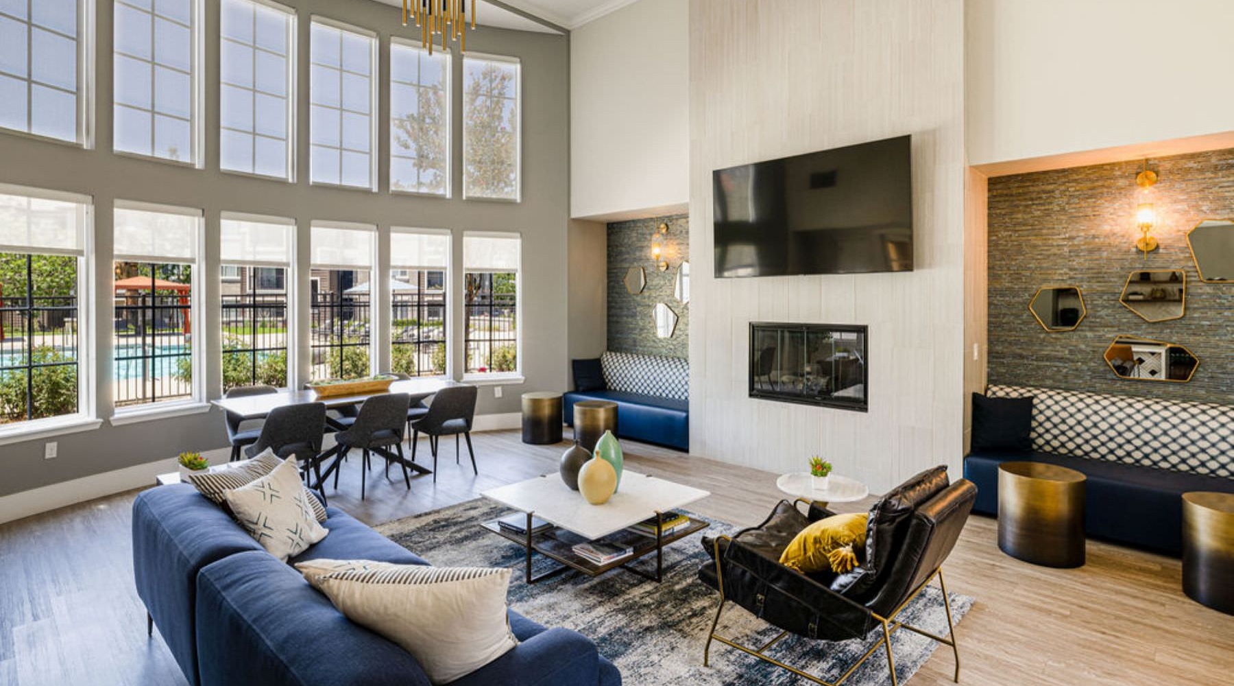 a clubroom with a couch, tv and chairs