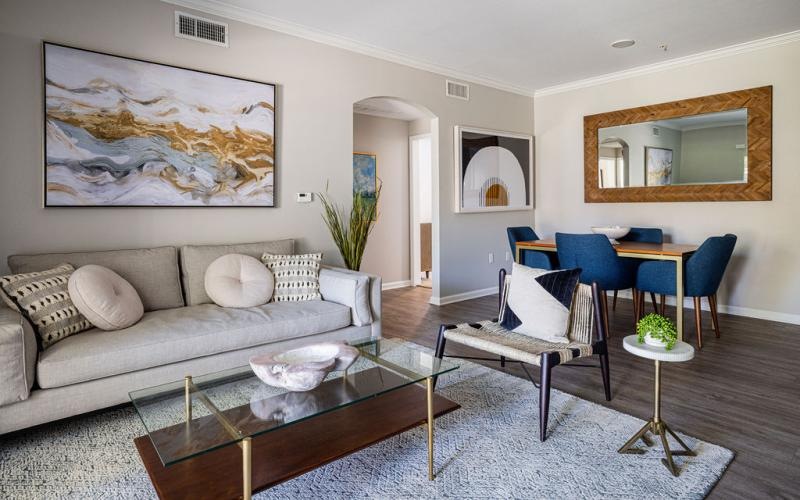 a living room with a couch and chairs